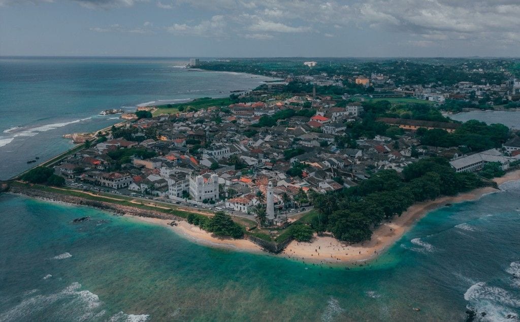 Aerial view of Galle Fort lighthouse, ramparts, and Indian Ocean, Sri Lanka